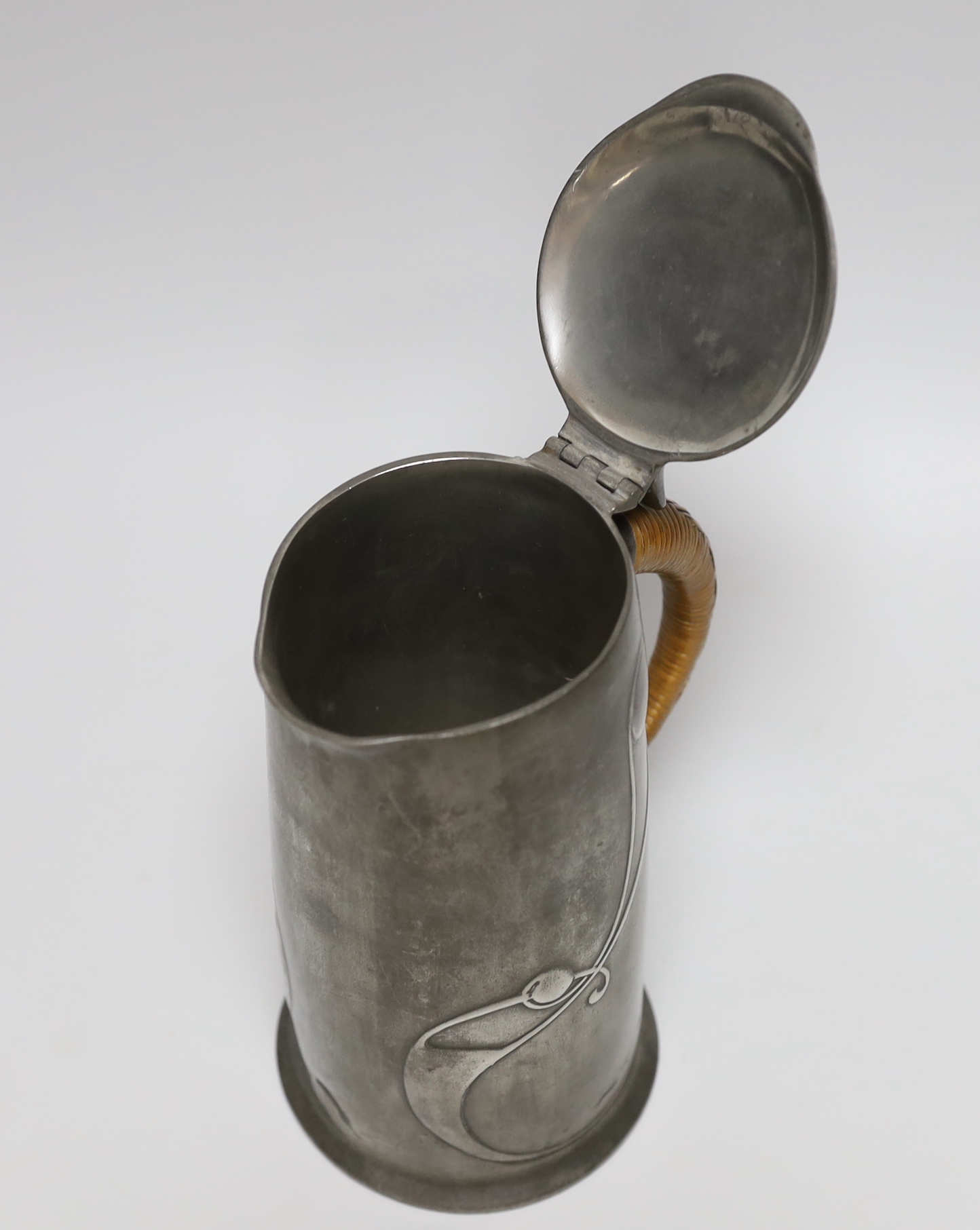 Archibald Knox for Liberty and Co., an Arts and Crafts Tudric pewter jug, model 0305, 15.5cm